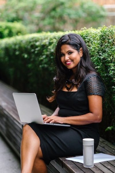 businesswoman on laptop smiling
